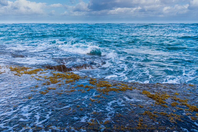 Poipu beach ragging waves