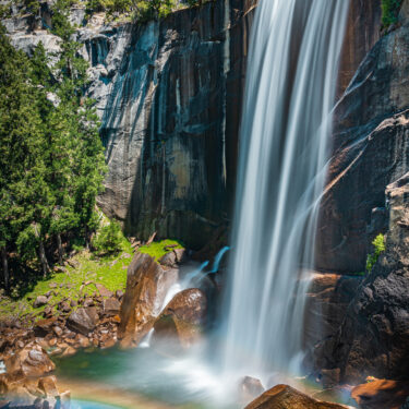Bridalveil waterfall with vibrant rainbow