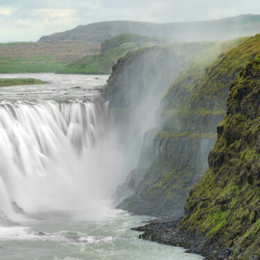 Gullfoss waterfall producing misty views.